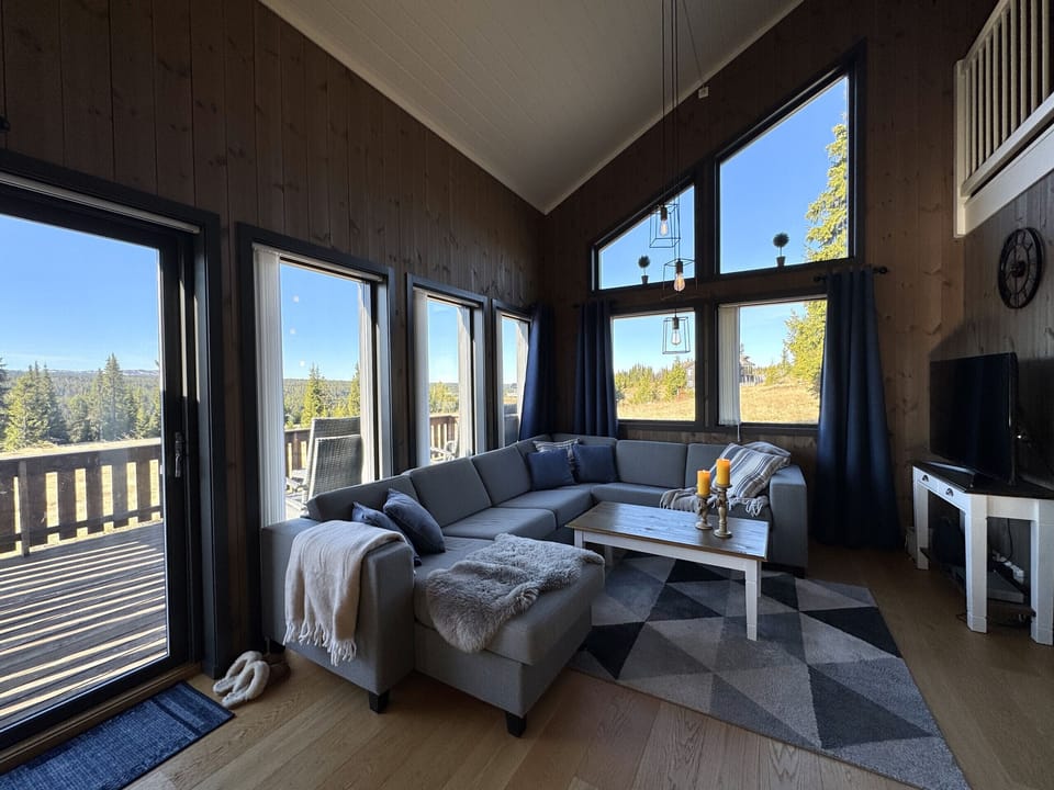 Cozy up in the warm sofa corner – perfect for relaxing after a day in the mountains