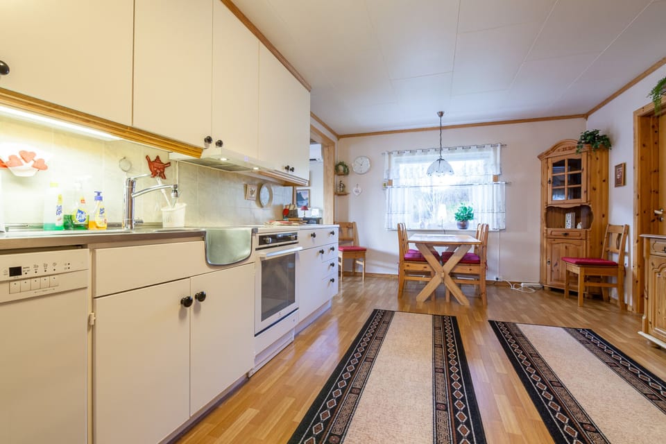 Spacious kitchen with dining area.