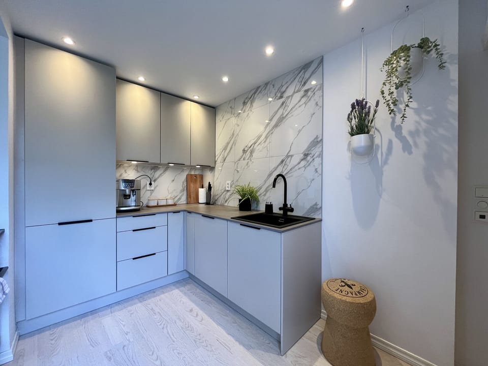 Fully equipped kitchen with a coffee machine.