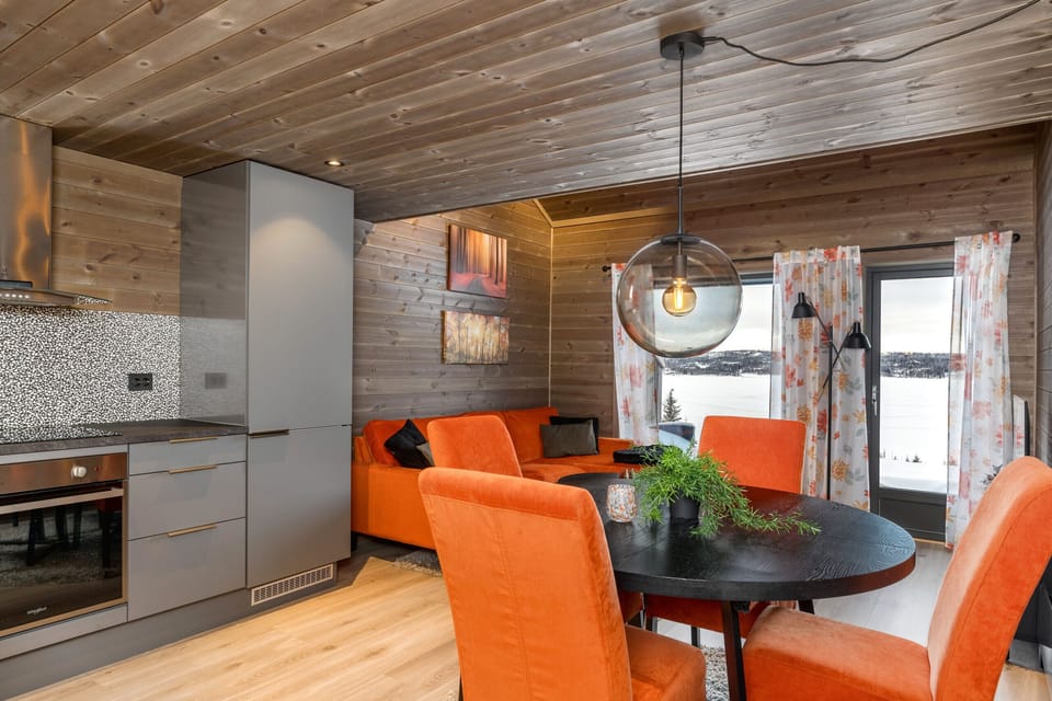 Cosy living room/kitchen area with access to the terrace.