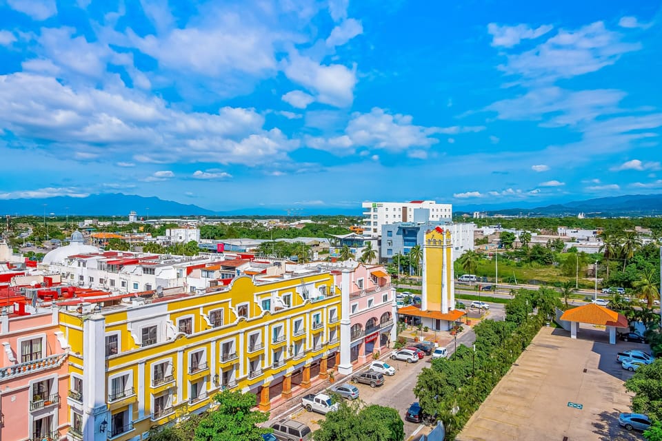Take in the colorful architecture, bustling streets, and distant mountain ranges from your elevated vantage point.