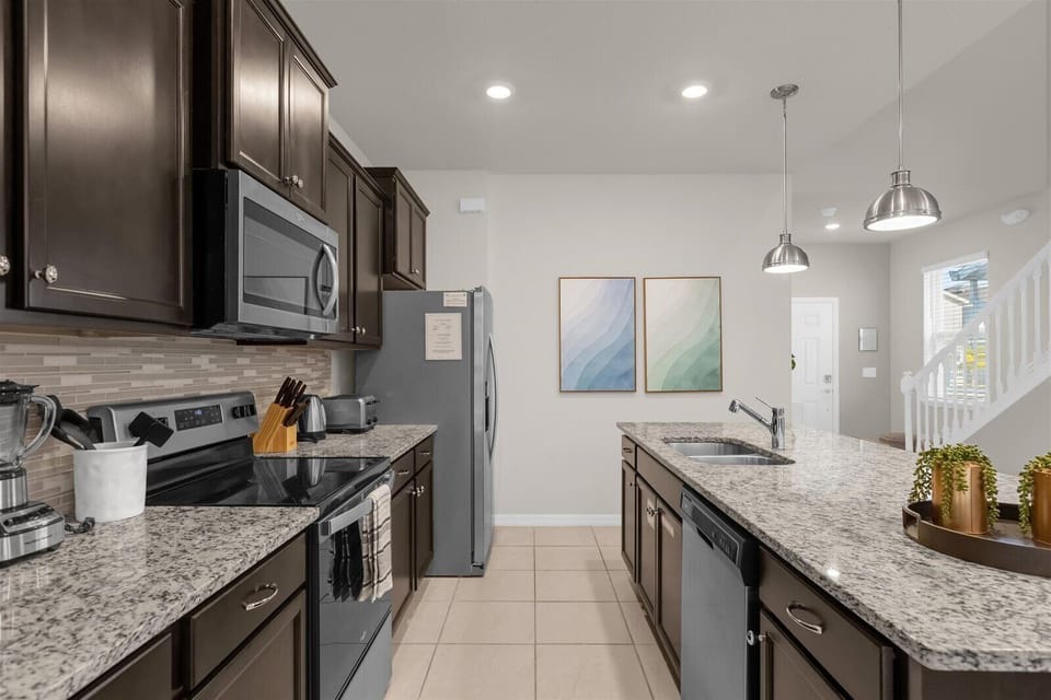 Kitchen with Fridge, Stove, Microwave, Dual Sink, & Dishwasher