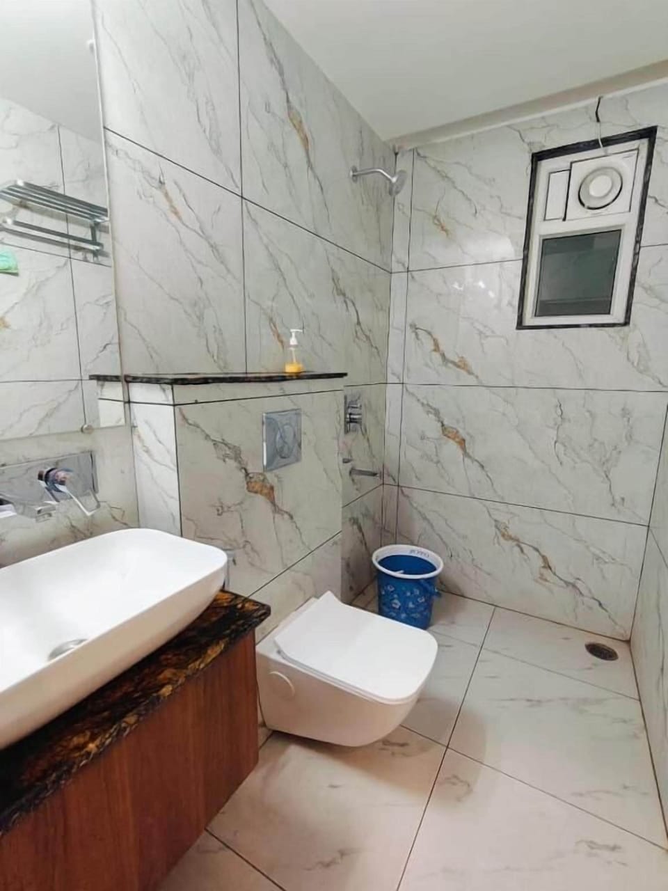 Shower, free toiletries, slippers, soap