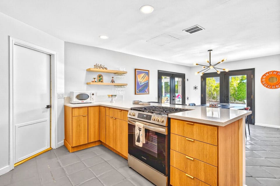 Updated modern kitchen with stainless appliances and ample storage