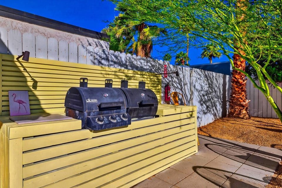 Outdoor dining and BBQ area by private pool