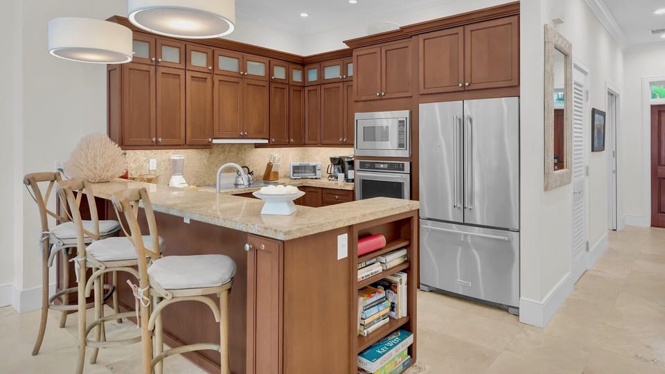 Your fully equipped kitchen features granite countertops and stainless steel appliances...