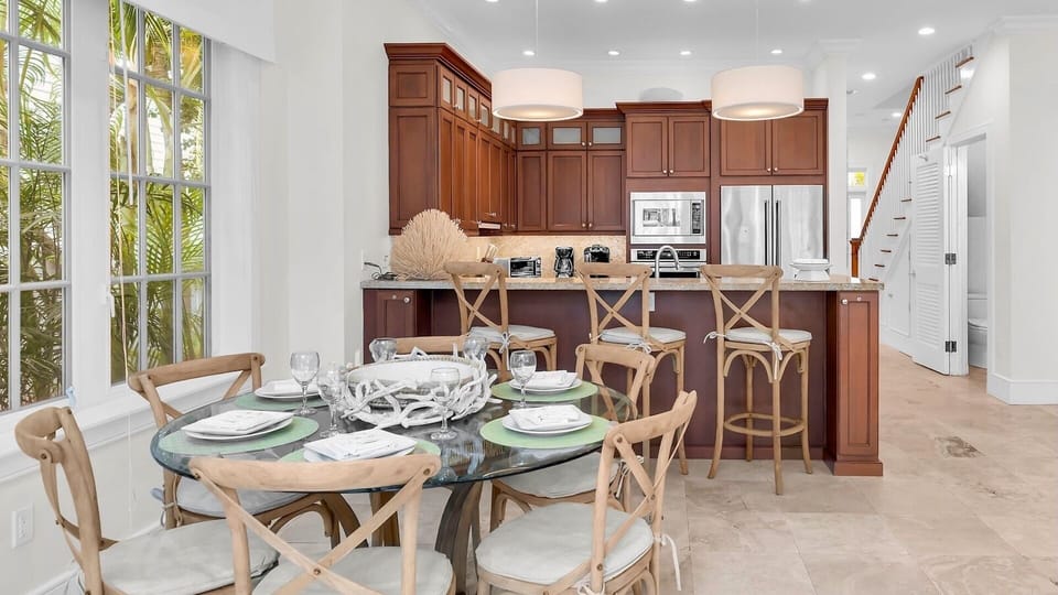 Your gourmet kitchen flows seamlessly into an elegant dining space...