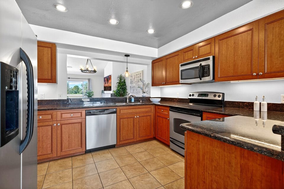 Fully equipped kitchen with modern appliances and ample counter space for cooking