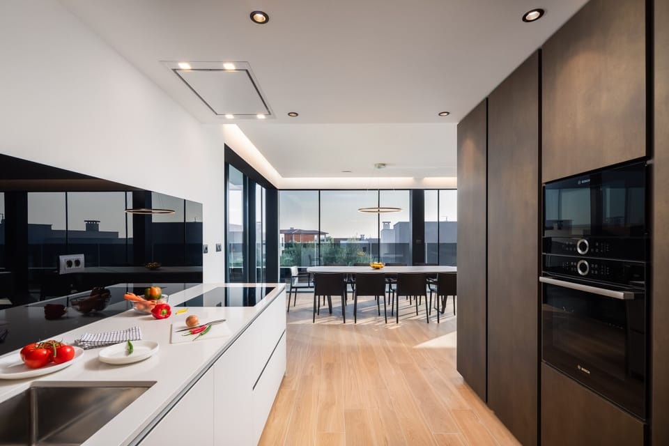 Kitchen with oven, microwave and cooktop