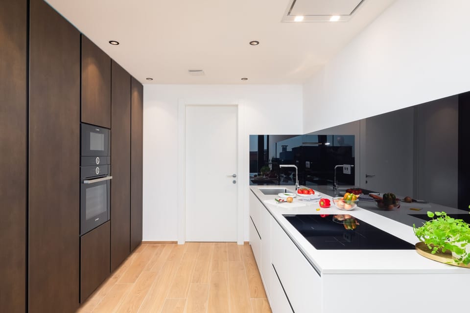 Kitchen with oven, microwave and cooktop