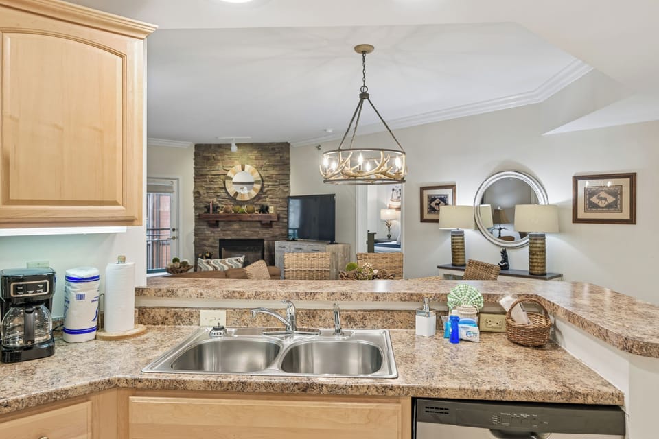 Your kitchen flows seamlessly into the living space, featuring granite counters and modern appliances for effortless meal prep while staying connected.
