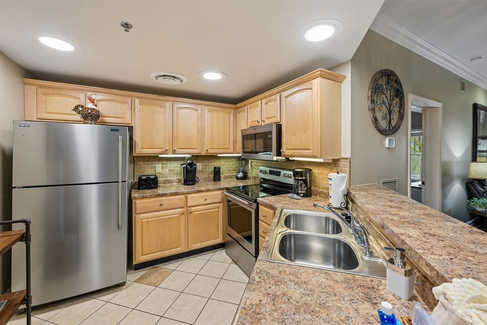 Cook your favorite meals in this fully equipped kitchen with granite counters, stainless appliances, and all the space you need.