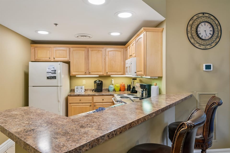 Your fully equipped kitchen features granite counters, modern appliances, and everything needed for home-cooked meals during your stay.