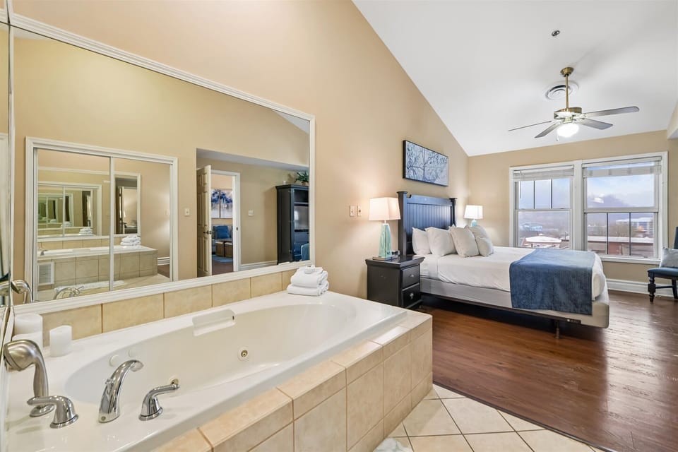 Unwind in your luxurious suite where relaxation meets romance—soak in your private jetted tub while enjoying stunning city views.