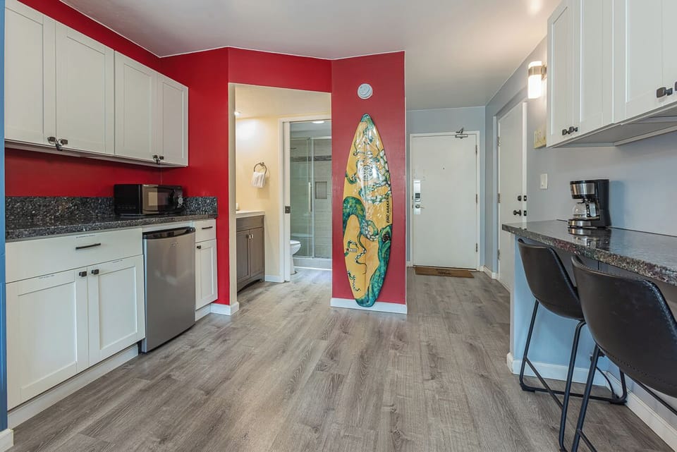 Kitchenette with vibrant tropical decor.