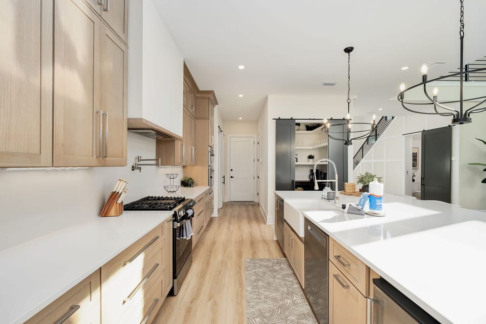 Equipped with premium appliances, including a gas range with a griddle and pot filler, bringing ease to every meal prepared.