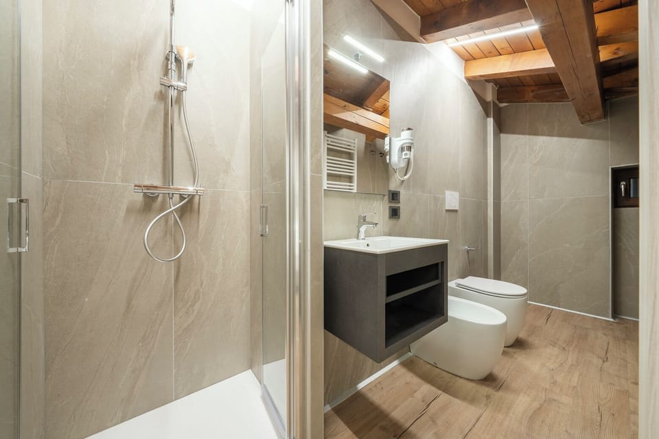 Triple Room | Bathroom | Shower, hair dryer, towels, soap