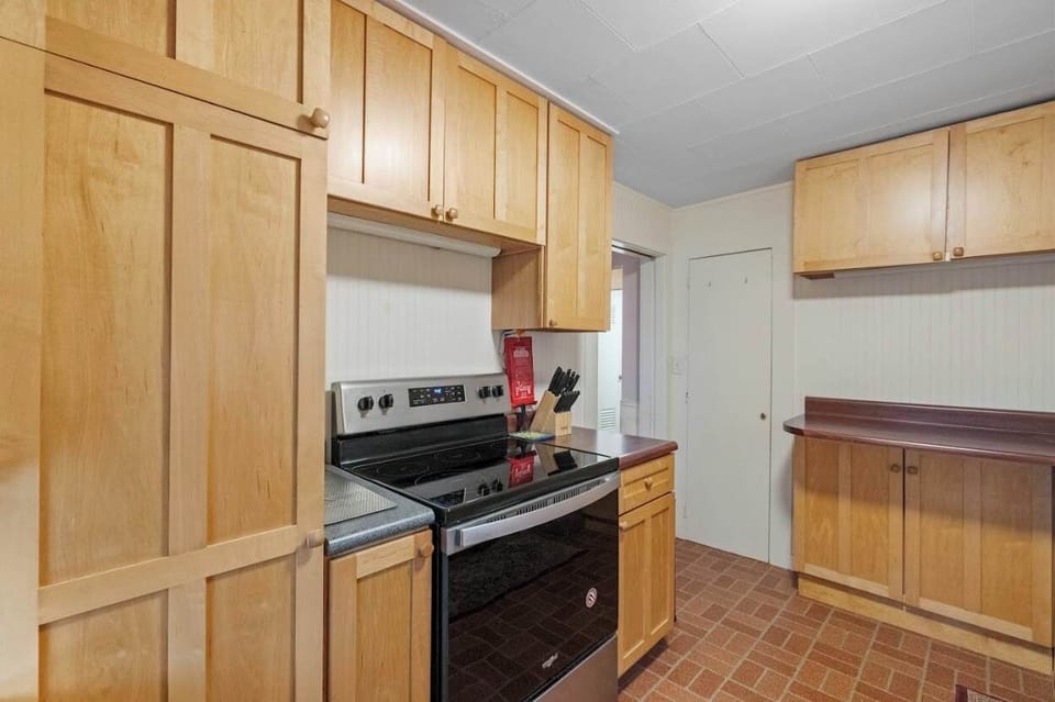 Modern appliances and classic wood cabinetry blend convenience with timeless charm.