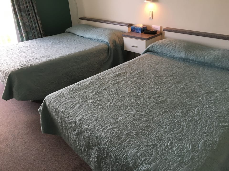 Classic Room, 2 Double Beds | Living area | 44-inch flat-screen TV with cable channels