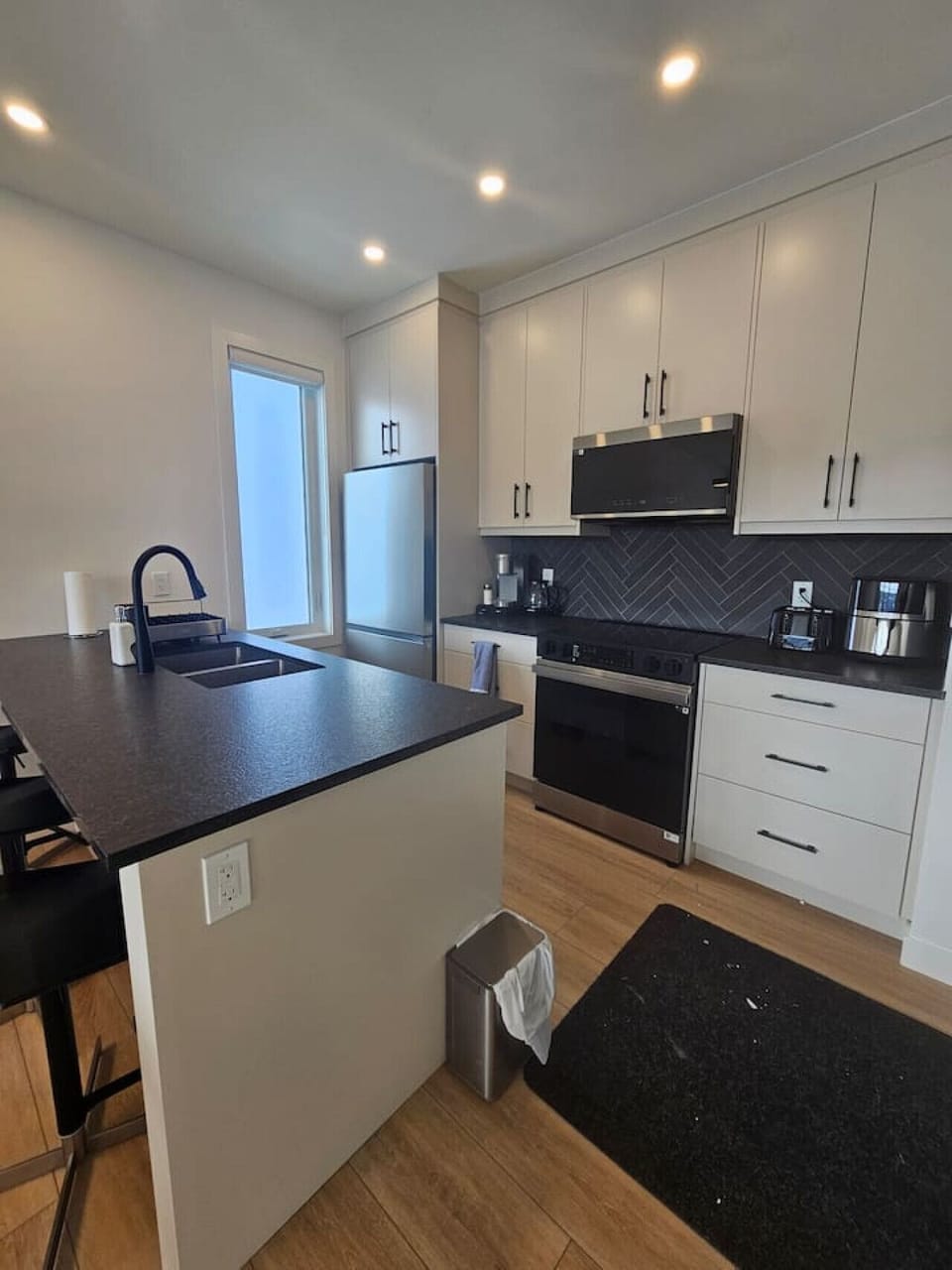 A chef’s dream. This modern, fully-equipped kitchen features premium appliances and ample counter space for easy meal prep.