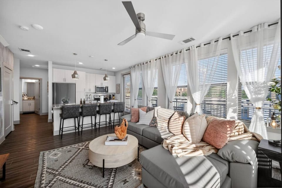 The perfect setup for staying connected: A spacious, comfortable seating area just steps from the breakfast bar and fully equipped kitchen