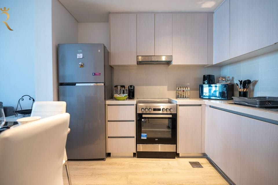 Fully equipped kitchen with modern appliances.