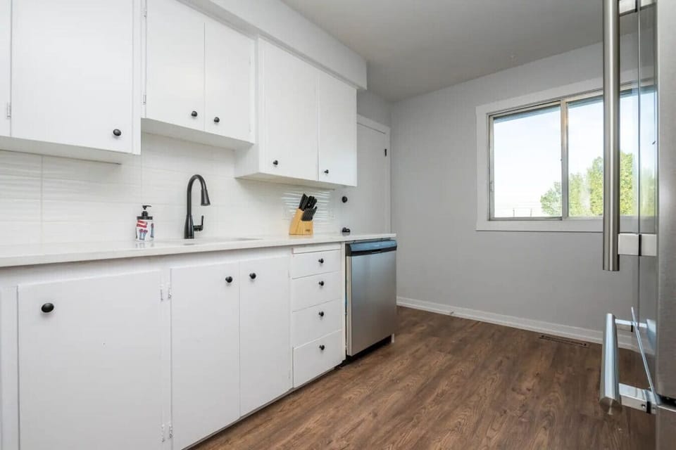 Modern kitchen with ample counter space and essential cookware provided