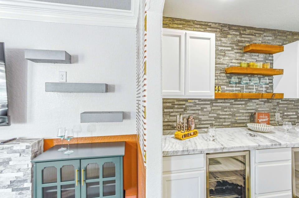 Why go out when you’ve got your own stylish wet bar? Drinks, good company, and zero lines—yes please.