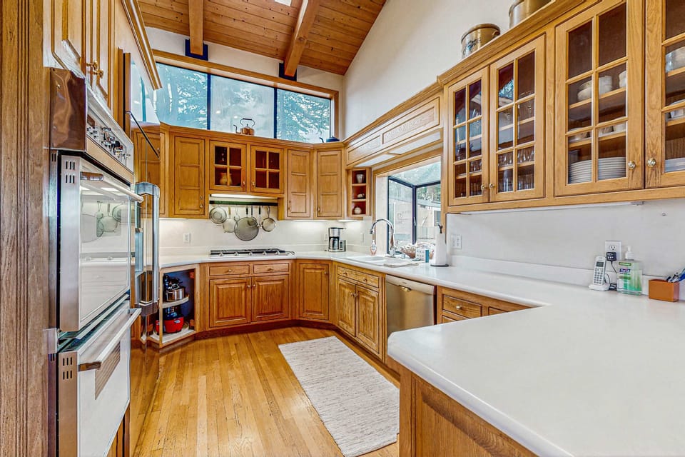 Cook up your favorite meals in this well-equipped kitchen, where natural light and modern amenities make every culinary moment enjoyable.