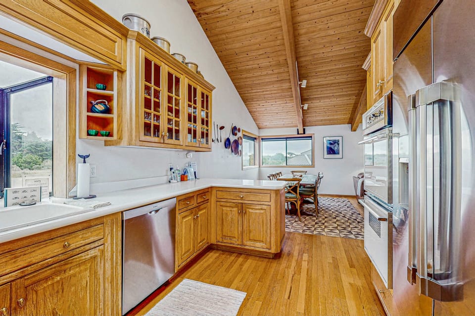 Prepare meals with ease in this inviting kitchen, designed for both practicality and inspiration from the surrounding nature.