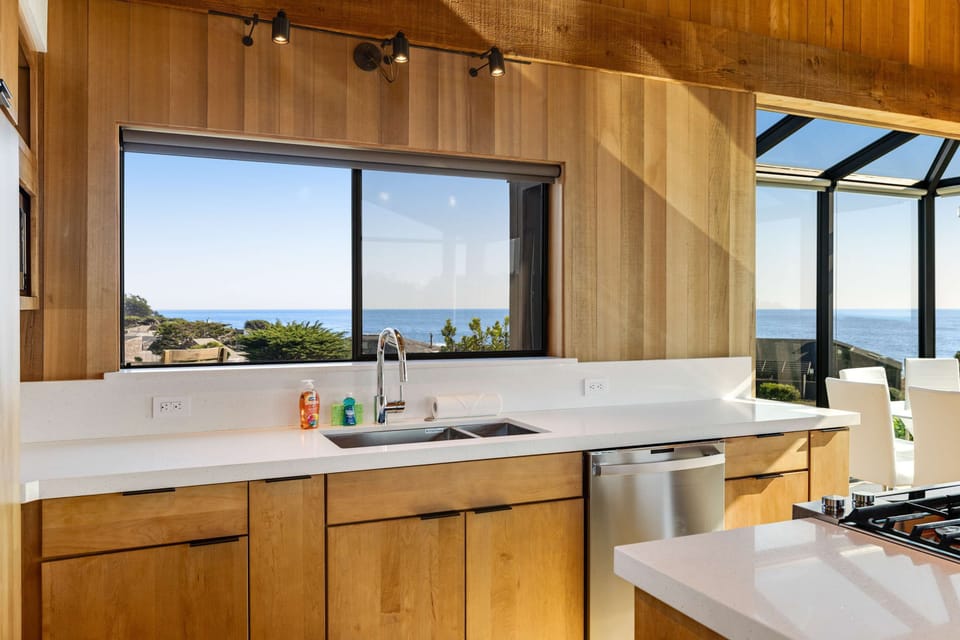 Elevate your culinary experiences in this beautifully crafted kitchen, where ocean vistas inspire creativity with every dish.