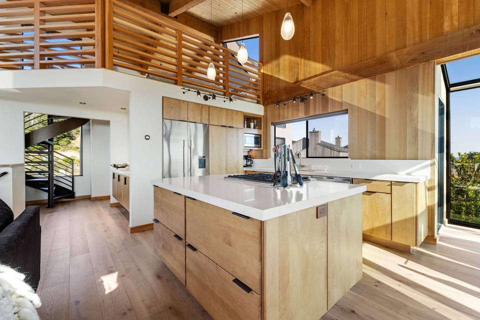 Craft delicious meals in this expansive kitchen, where modern design meets functionality, all while enjoying stunning views of the coastline.
