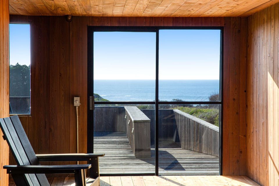Imagine sipping a glass of wine on the deck as you take in sweeping ocean views, a perfect end to your day.