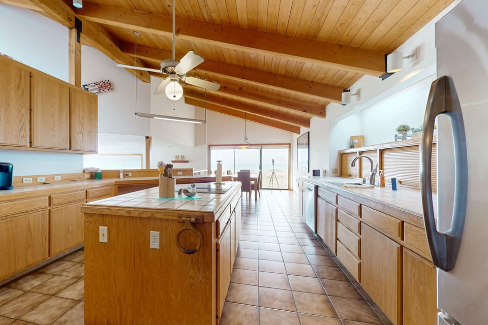 With a seamless flow to the deck, this kitchen invites you to whip up a feast while enjoying the coastal breeze and the sound of waves.