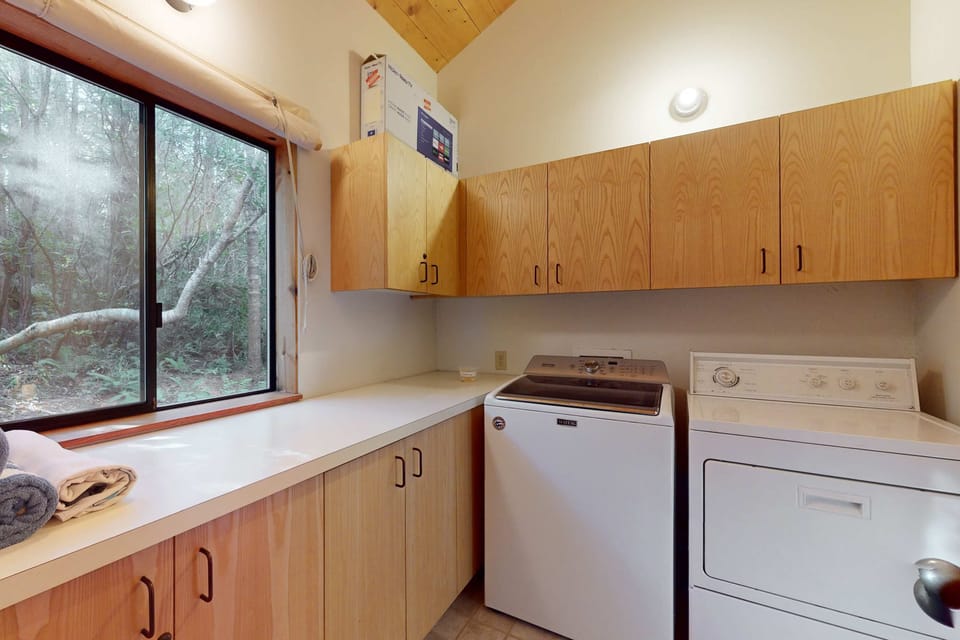 A dedicated laundry area makes it easy to refresh your belongings during your stay, ensuring you have everything you need for a carefree getaway.
