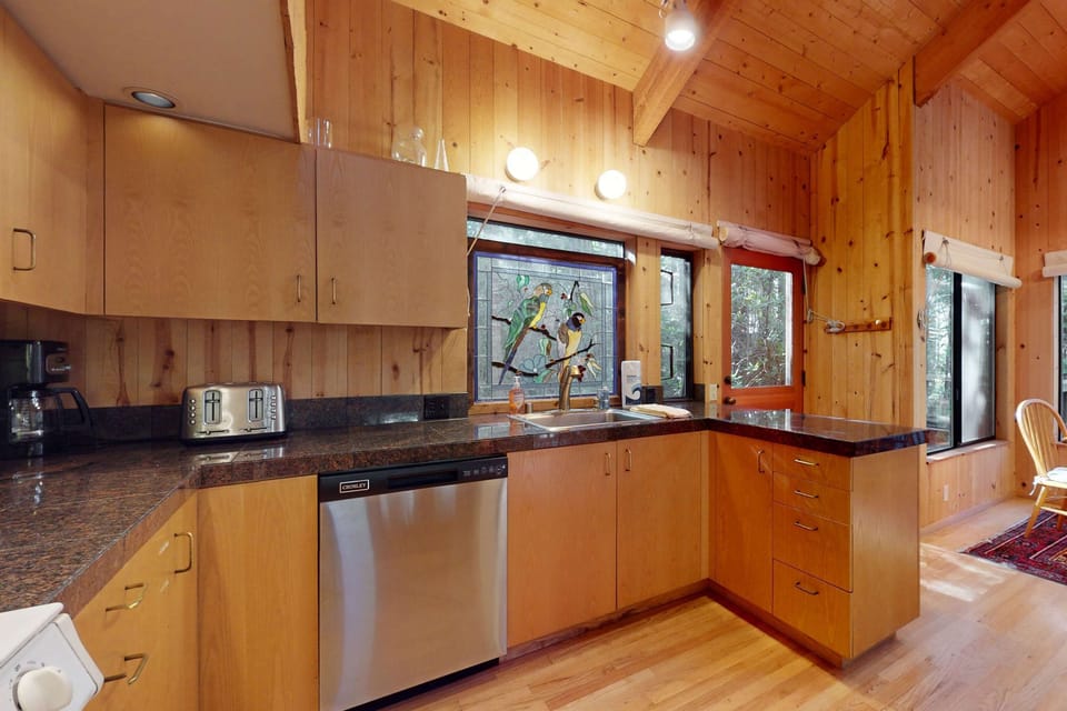Bright and inviting, this well-equipped kitchen invites you to whip up your favorite dishes while soaking in the serene surroundings.