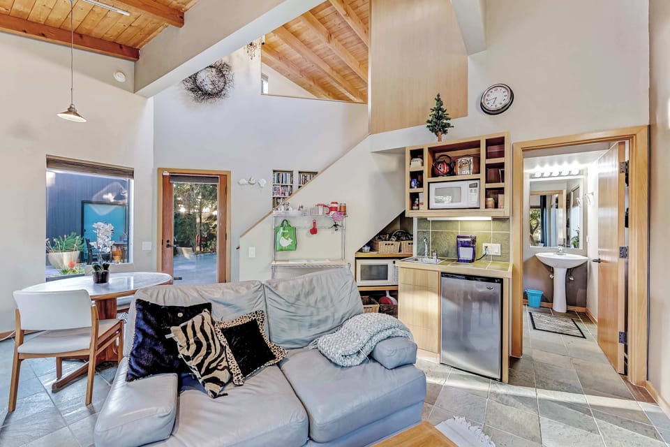 This open living area seamlessly connects to the kitchen, perfect for sharing meals and moments together.