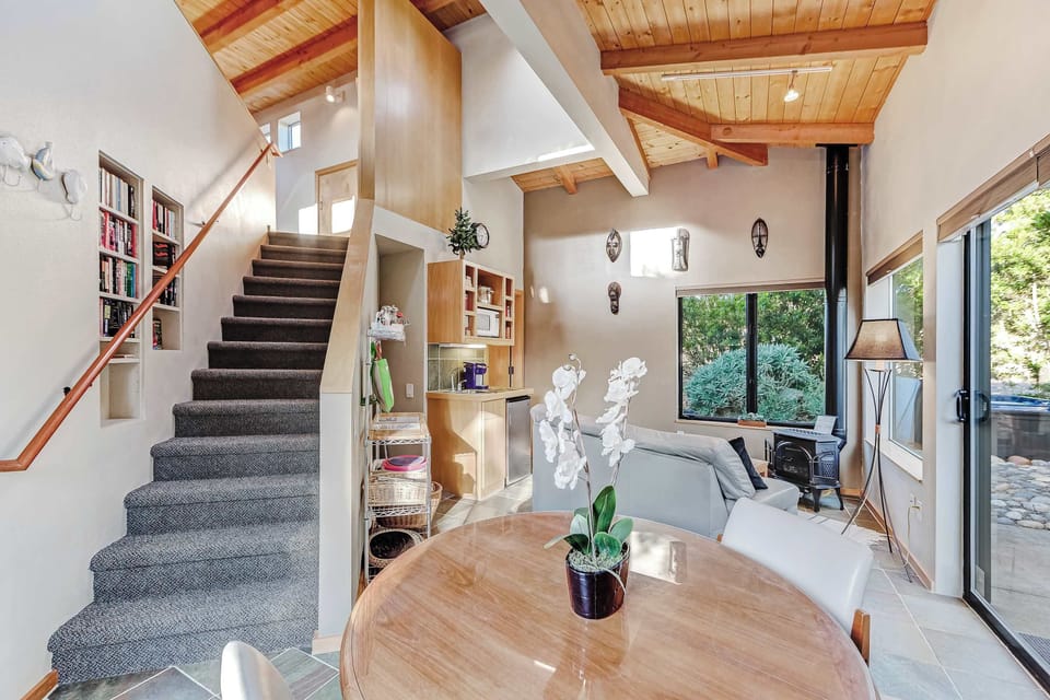 Ascend the staircase to discover a cozy living space that invites relaxation and connection with loved ones.