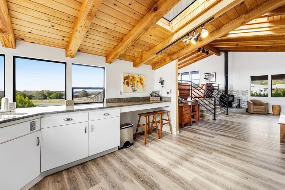 With its airy layout and bright windows, this kitchen makes meal prep a delight while you enjoy the scenic outdoors.