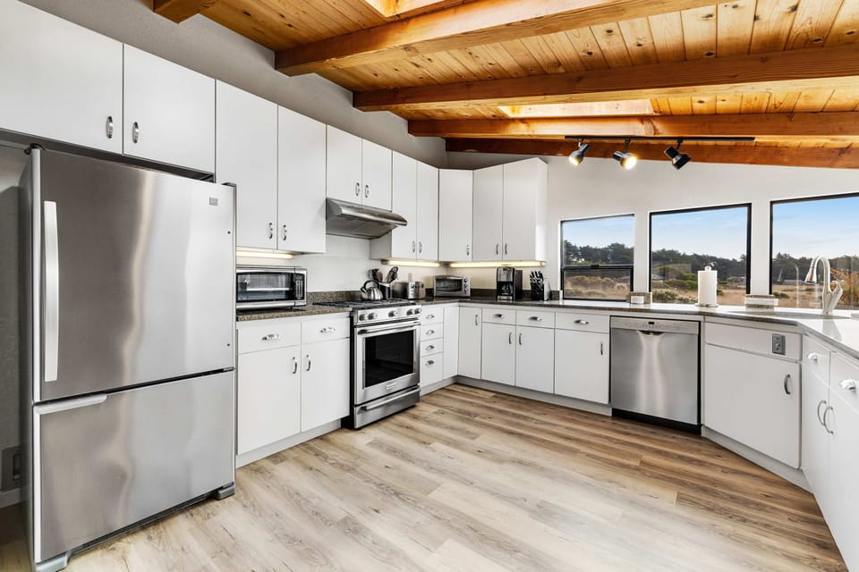 Cook up your favorite meals in this well-appointed kitchen, where modern amenities meet stunning natural light.