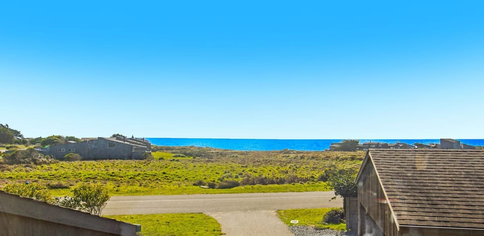 Gaze at the endless ocean from your doorstep, where the horizon meets the vibrant landscape of Sea Ranch.