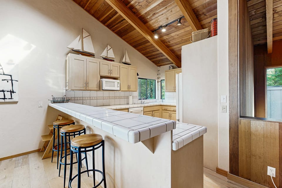 Unleash your culinary creativity in the well-equipped kitchen, where ample counter space makes meal prep a delight.