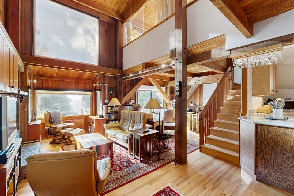 Morning light spills into the living room, inviting you to relax with a book or gather with loved ones by the gas fireplace.