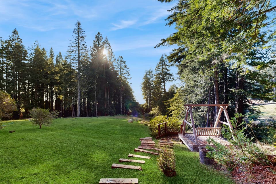 Explore your private yard, where well-maintained paths lead you through lush greenery, perfect for an afternoon stroll.