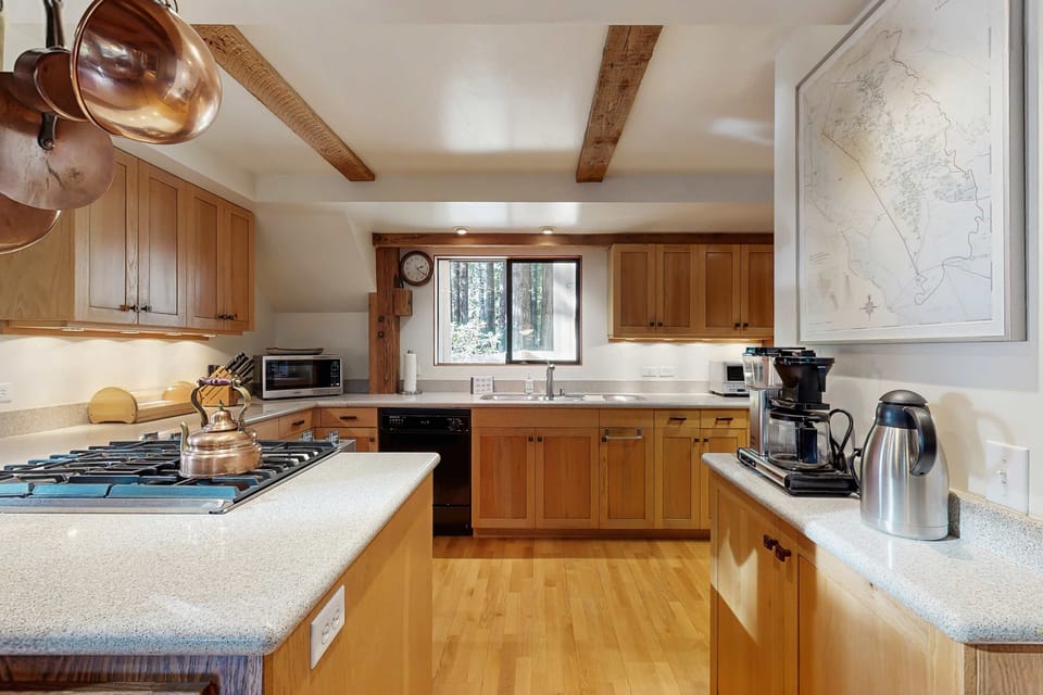 Gourmet kitchen is ready for your culinary creations, equipped with modern appliances and ample space for gatherings.