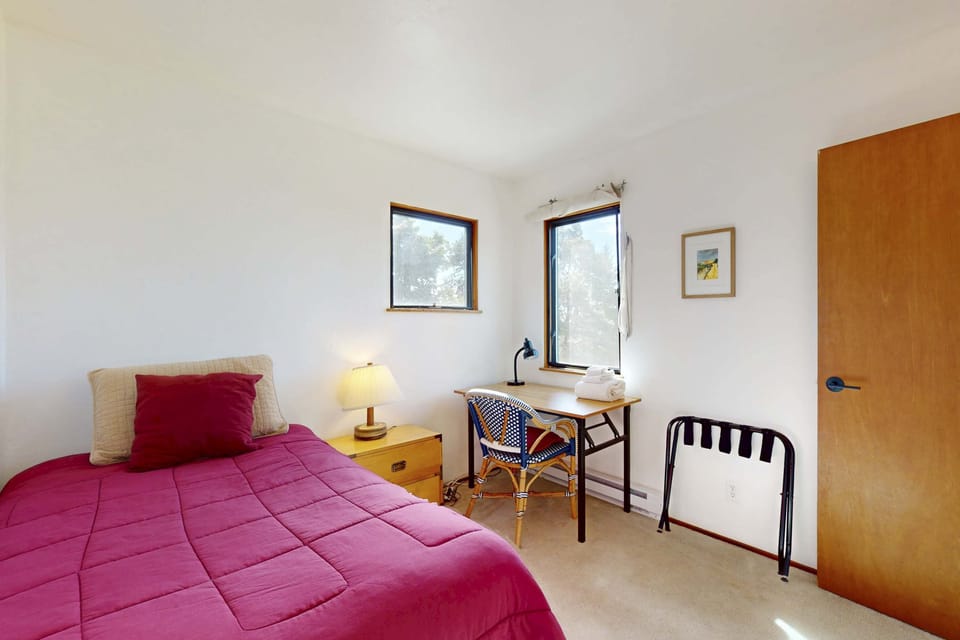 This cozy guest room offers a tranquil retreat, perfect for unwinding after a day of exploring the beautiful coastline.