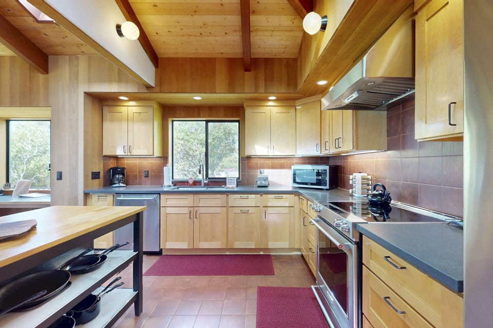Bright and airy, this kitchen offers ample space for culinary adventures while enjoying views that inspire your creativity.