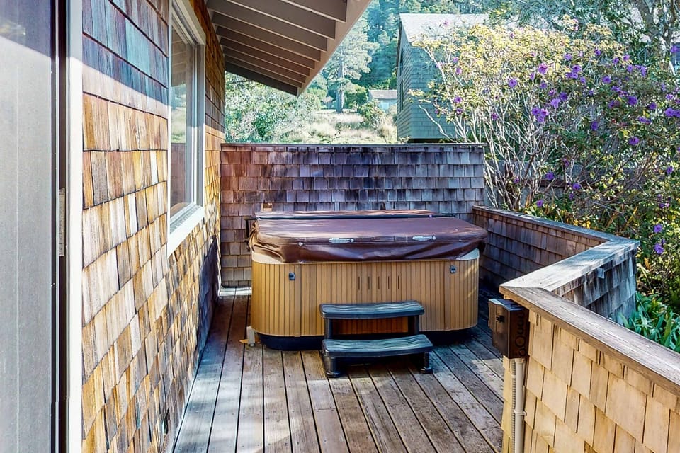 Soak your cares away in the private hot tub, nestled in a serene corner, perfect for starlit evenings or peaceful afternoons.