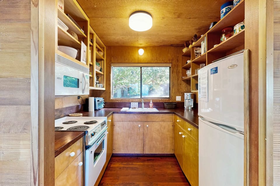 Cook up your favorite meals in this well-equipped kitchen, with views that inspire culinary creativity.