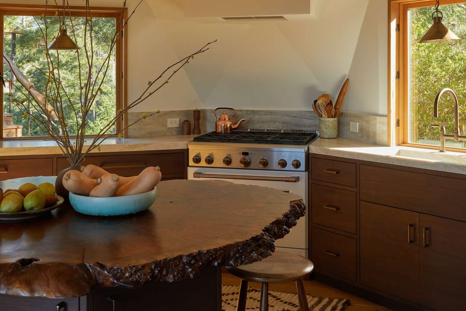 Experience the harmony of nature and style in this well-appointed kitchen, where culinary creativity meets the beauty of the outdoors.